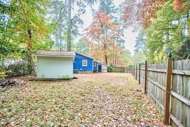 a view of a house with a tree
