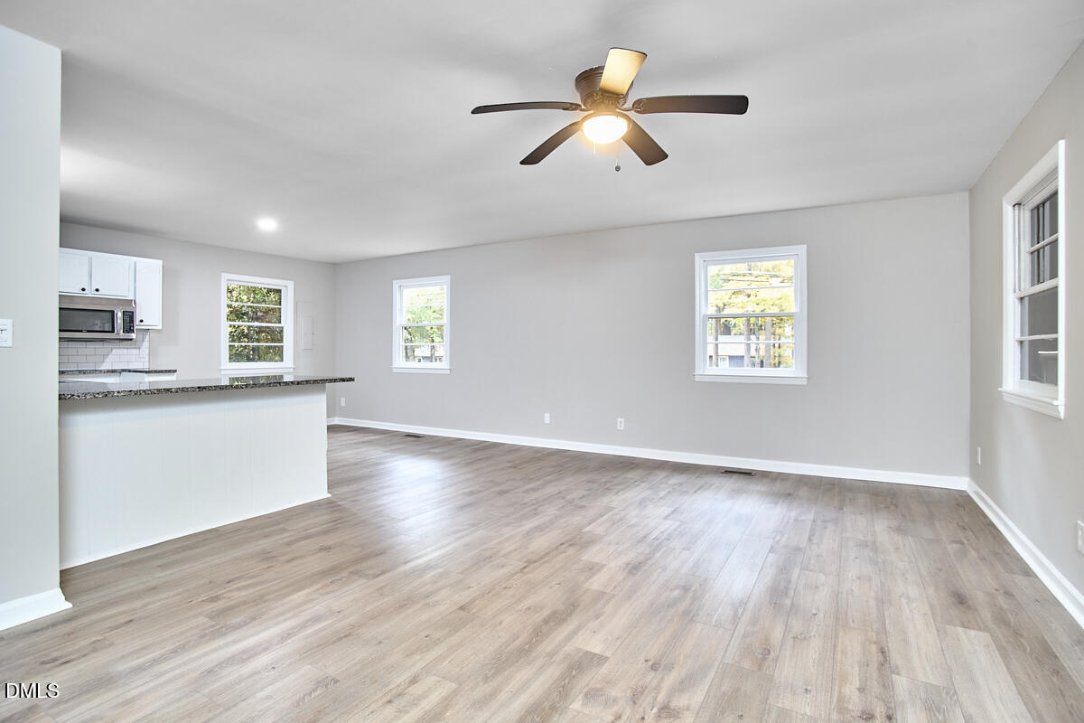 2128 Strebor Street Durham, NC 27705 - Photo 10 of 51 wooden floor in an empty room with a window