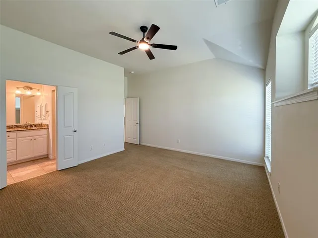 a view of a big room with wooden floor closet and windows