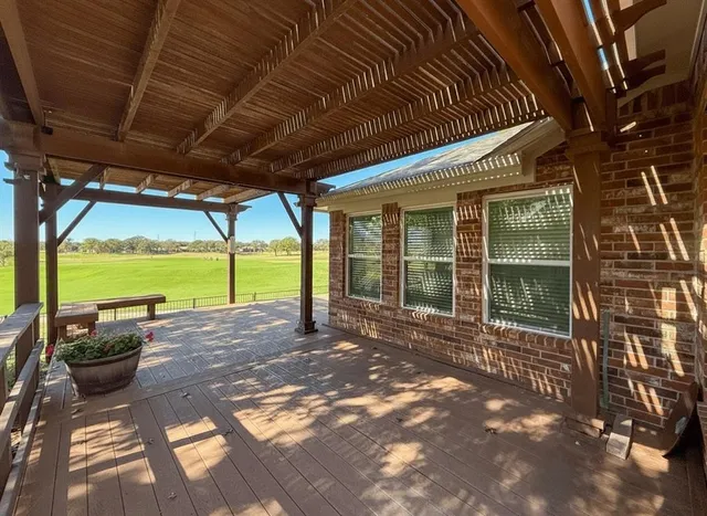 a view of a house with backyard and porch
