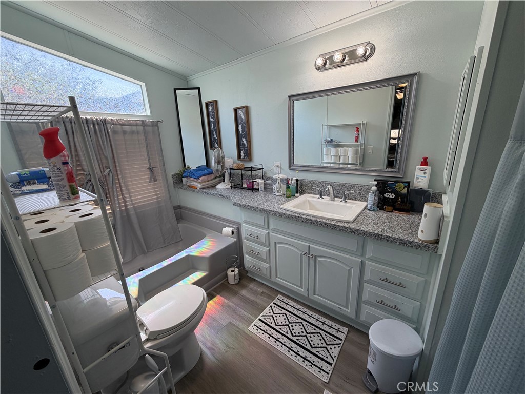 1550 Rimpau, Unit 71 Corona, CA 92881 - Photo 18 of 51 a bathroom with a sink mirror vanity and toilet