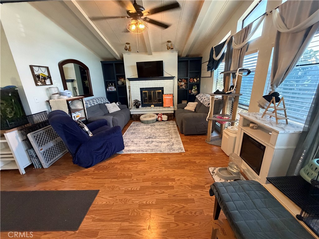 1550 Rimpau, Unit 71 Corona, CA 92881 - Photo 2 of 51 a living room with furniture and a fireplace
