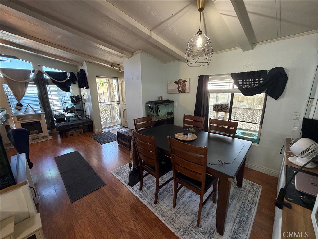 1550 Rimpau, Unit 71 Corona, CA 92881 - Photo 21 of 51 a view of a dining room with furniture window and wooden floor