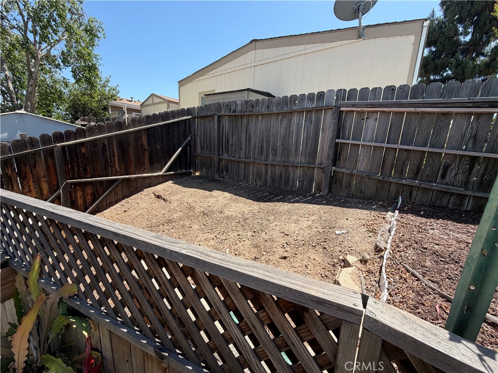 1550 Rimpau, Unit 71 Corona, CA 92881 - Photo 30 of 51 a view of wooden fence and floor