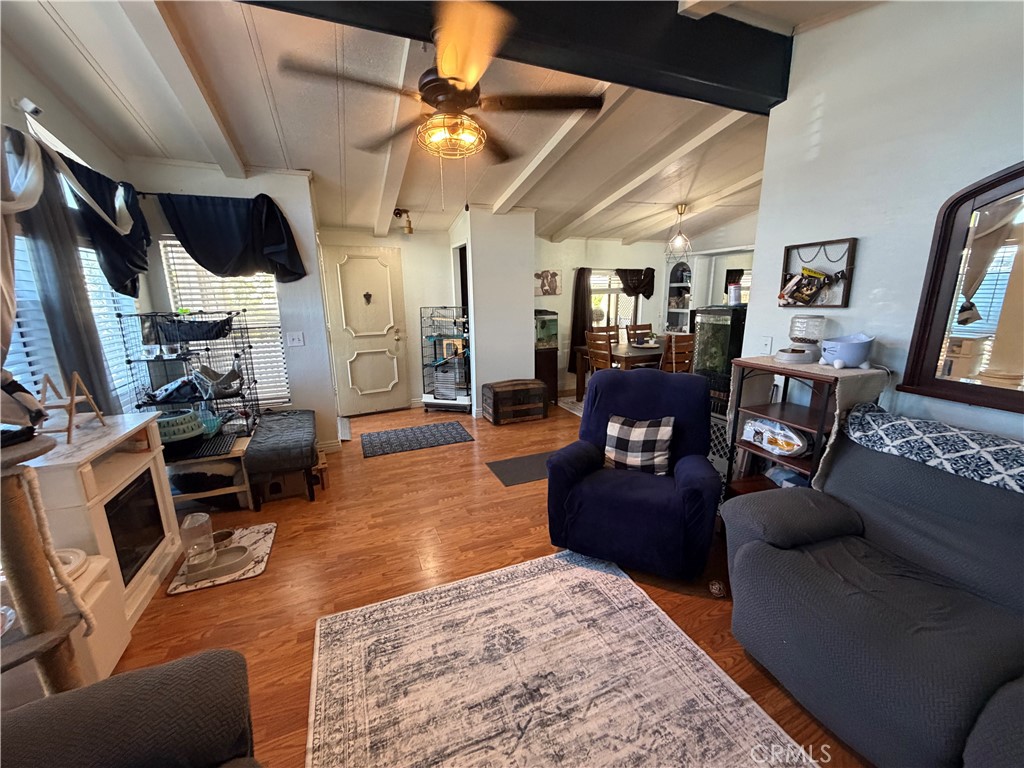 1550 Rimpau, Unit 71 Corona, CA 92881 - Photo 3 of 51 a living room with furniture and a flat screen tv
