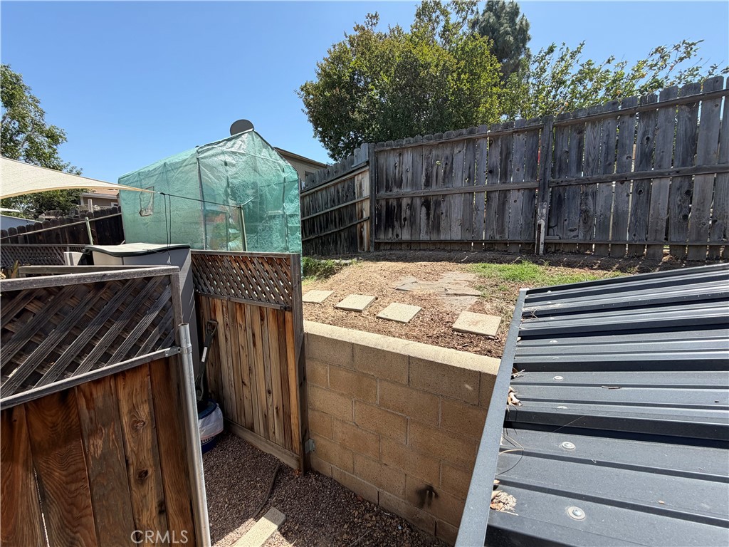 1550 Rimpau, Unit 71 Corona, CA 92881 - Photo 31 of 51 a view of a backyard