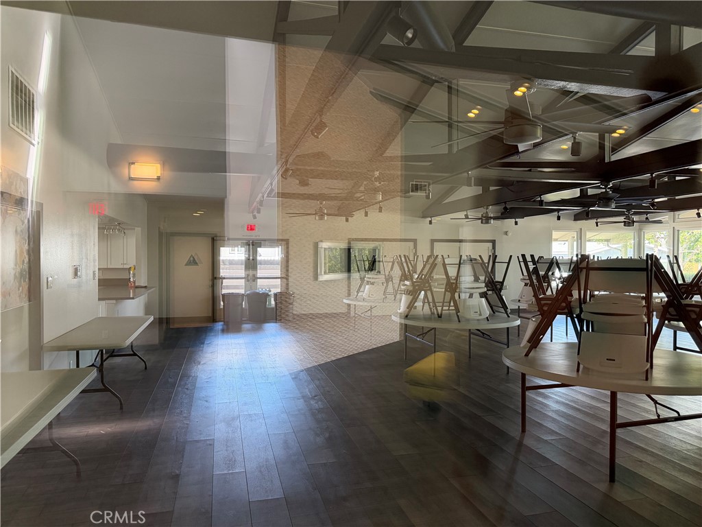 1550 Rimpau, Unit 71 Corona, CA 92881 - Photo 49 of 51 a view of a livingroom with furniture wooden floor and windows