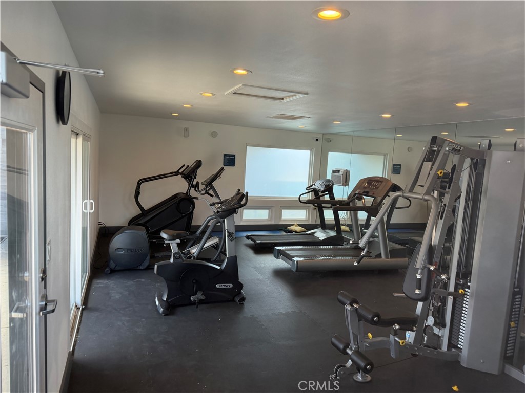 1550 Rimpau, Unit 71 Corona, CA 92881 - Photo 50 of 51 a view of a room with gym equipment