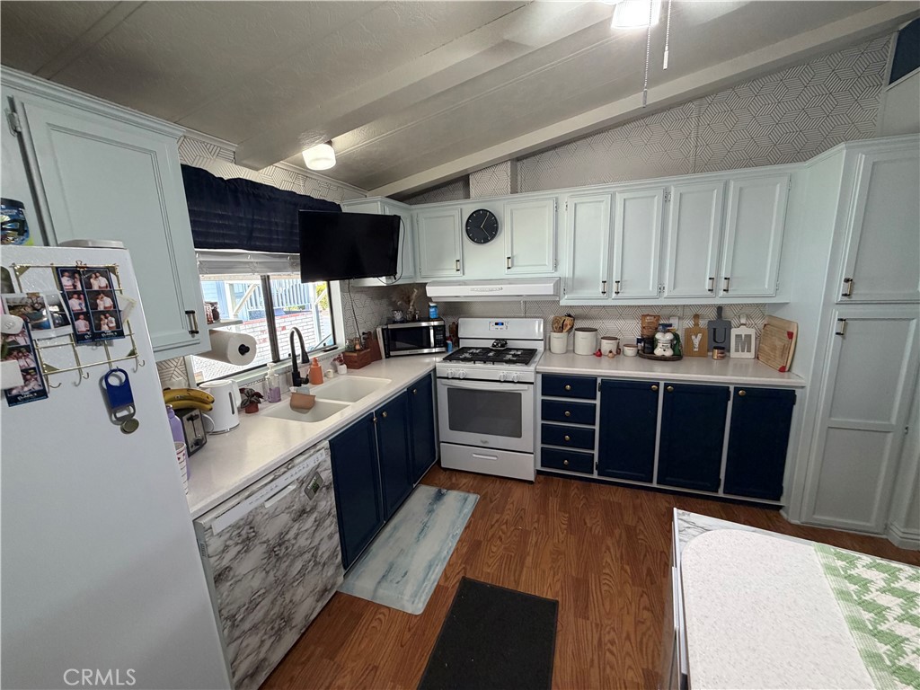 1550 Rimpau, Unit 71 Corona, CA 92881 - Photo 6 of 51 a kitchen with stainless steel appliances granite countertop a stove sink and cabinets