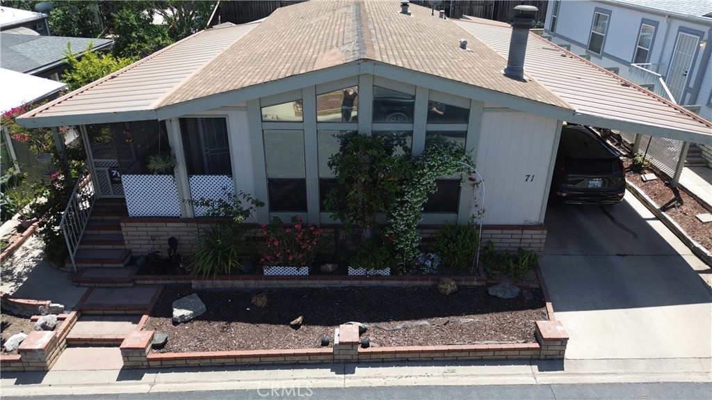 1550 Rimpau, Unit 71 Corona, CA 92881 - Photo 7 of 51 a view of a house with a yard