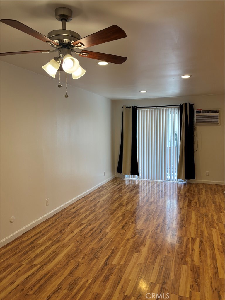 14718 Magnolia Boulevard, Unit 5 Sherman Oaks, CA 91403 - Photo 3 of 7 a view of an empty room with a chandelier fan