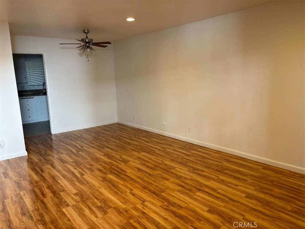 14718 Magnolia Boulevard, Unit 5 Sherman Oaks, CA 91403 - Photo 5 of 7 wooden floor in an empty room with a window