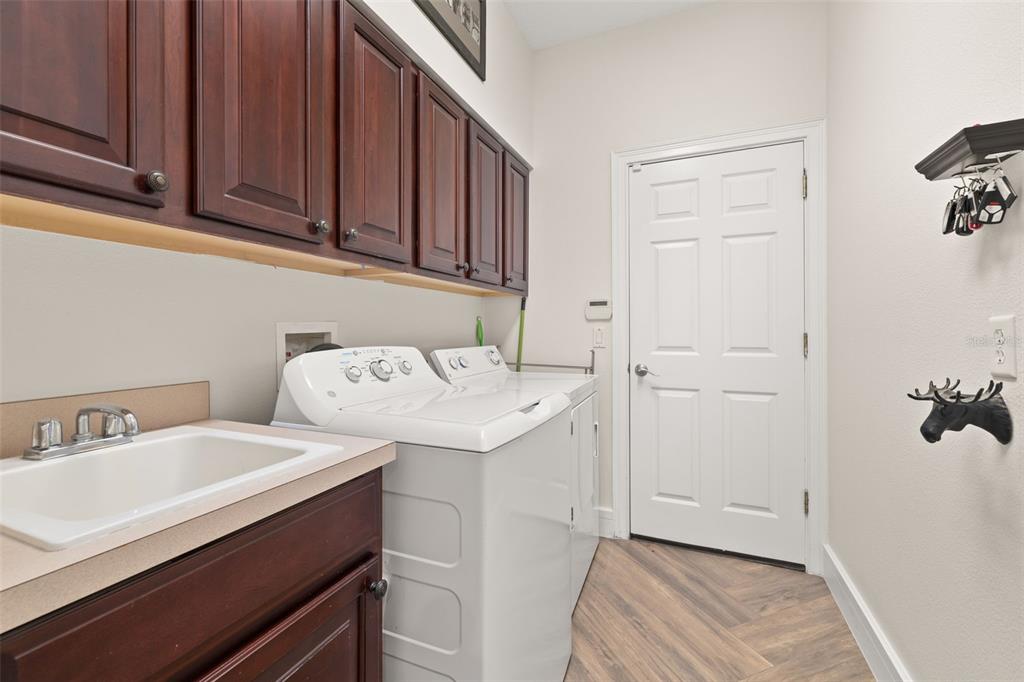 8351 Bowden Way Windermere, FL 34786 - Photo 37 of 71 a utility room with dryer and washer