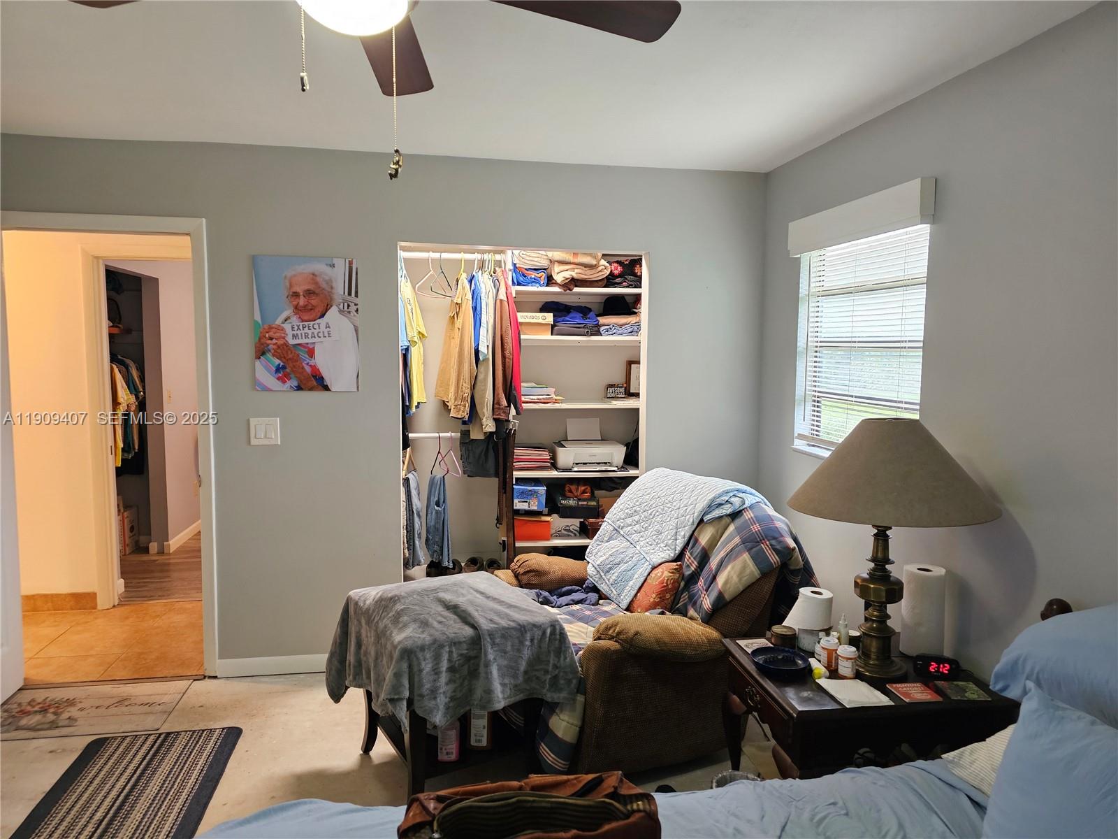 5108 Myrtle Drive Fort Pierce, FL 34982 - Photo 12 of 30 a bedroom with a bed and wooden floor