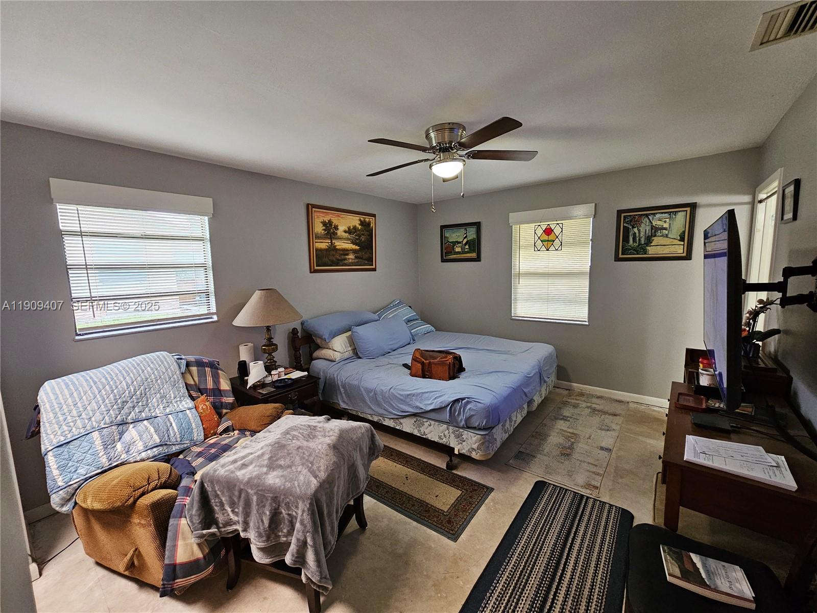 5108 Myrtle Drive Fort Pierce, FL 34982 - Photo 14 of 30 a living room with furniture and a flat screen tv