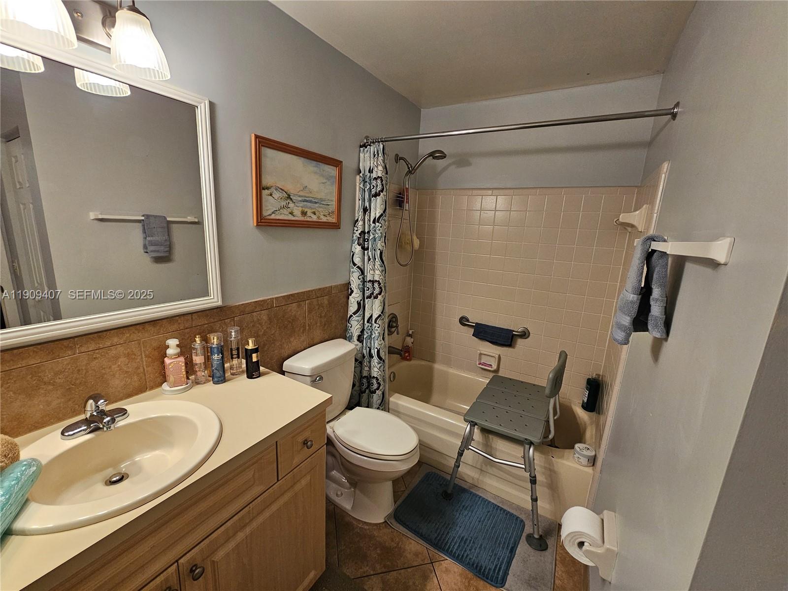5108 Myrtle Drive Fort Pierce, FL 34982 - Photo 16 of 30 a bathroom with a sink and a mirror