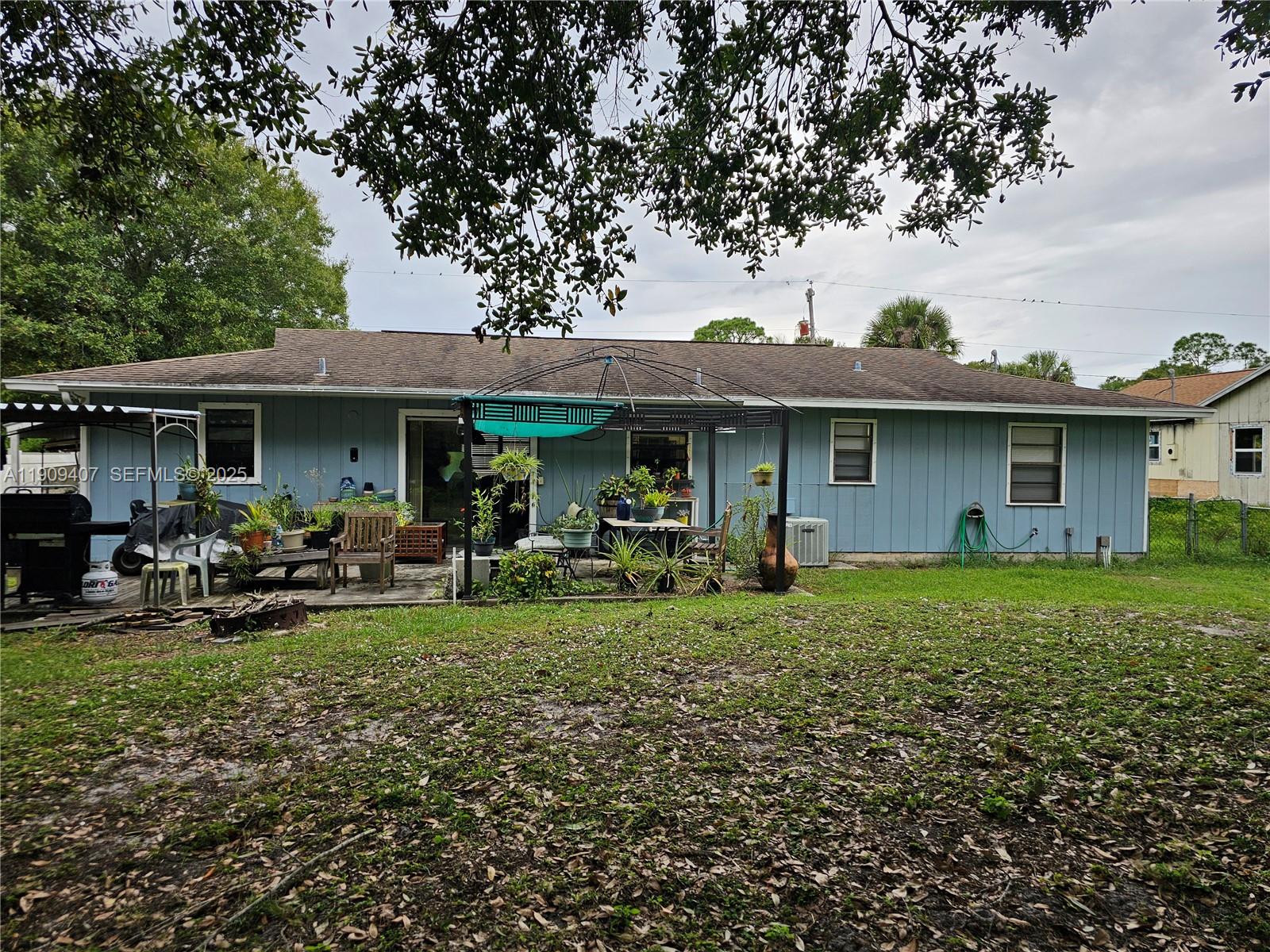 5108 Myrtle Drive Fort Pierce, FL 34982 - Photo 8 of 30 a front view of a house with garden