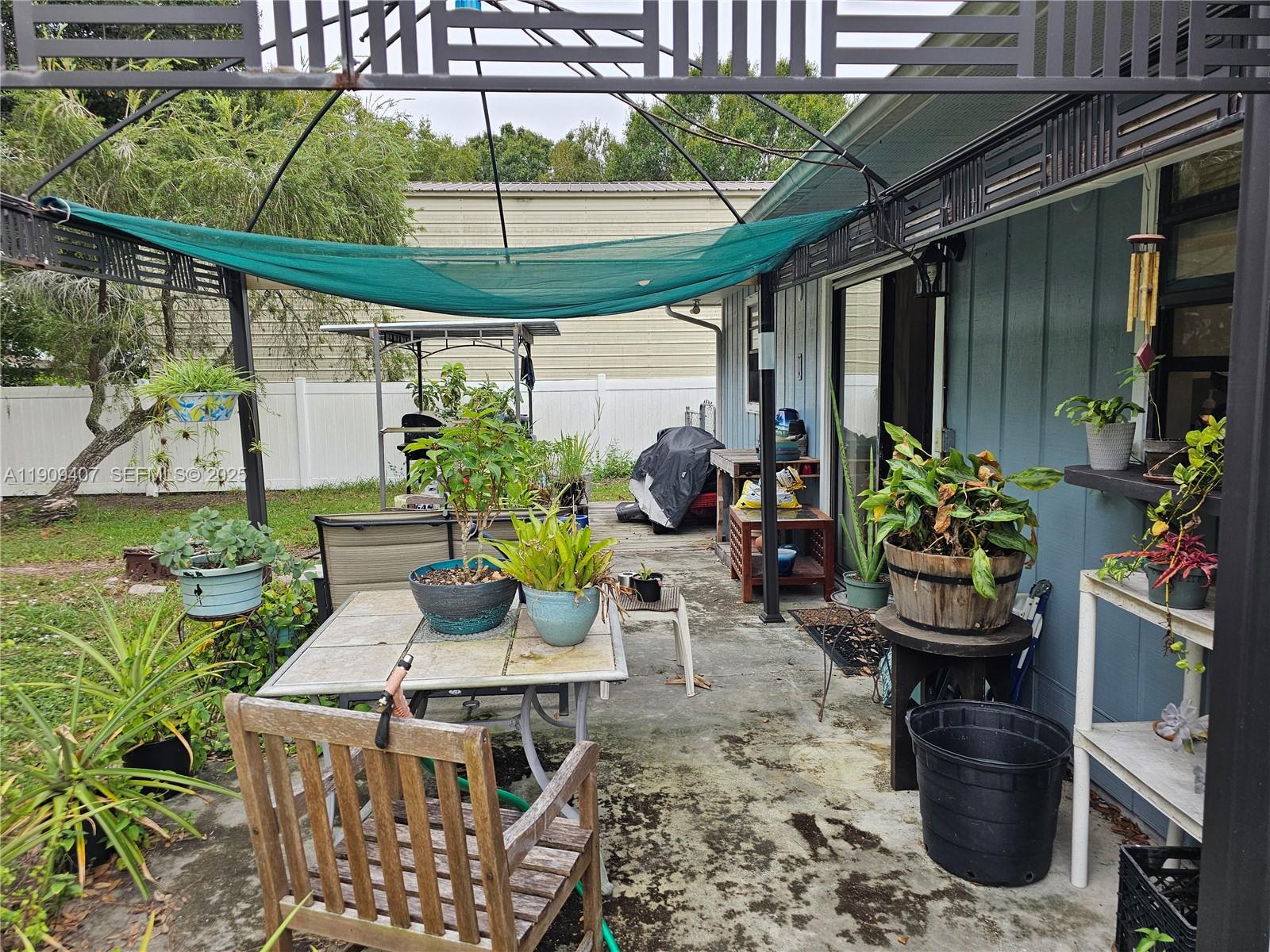 5108 Myrtle Drive Fort Pierce, FL 34982 - Photo 9 of 30 a view of a patio filled with furniture