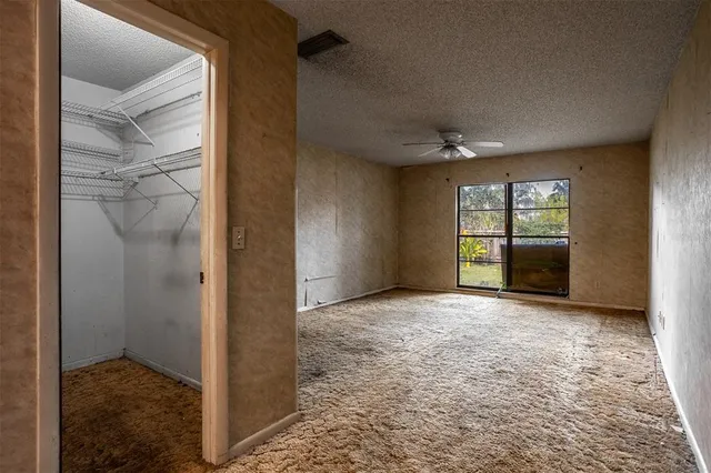 a view of an empty room and window