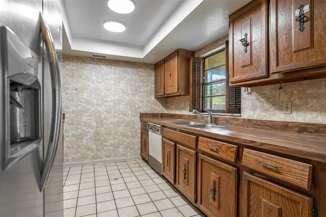 a bathroom with a granite countertop sink a toilet and a mirror