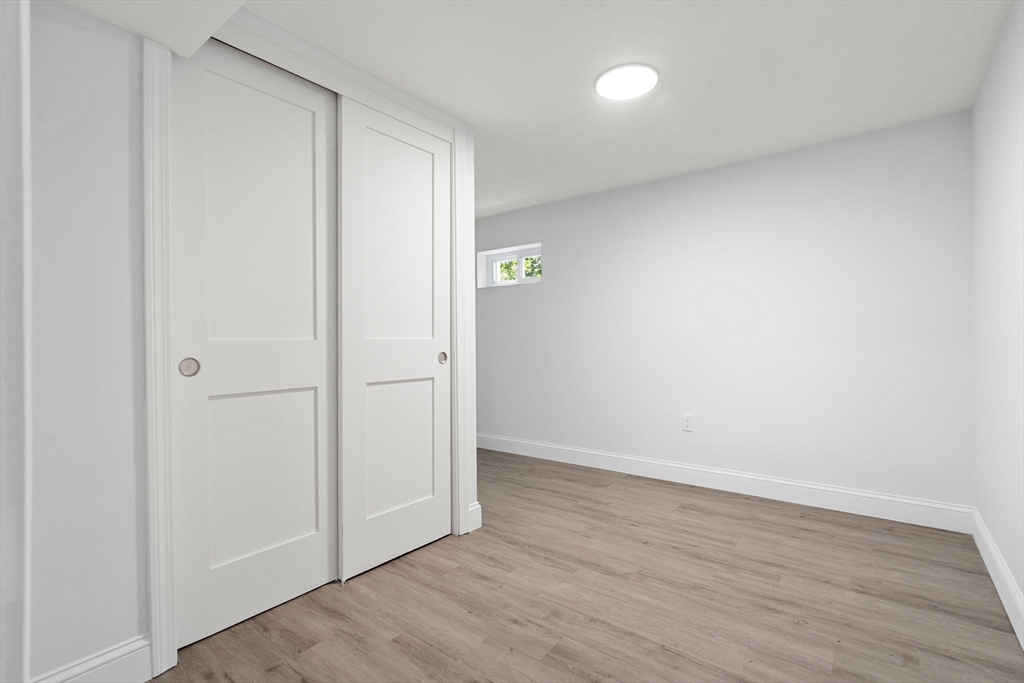 50 Bow Street Saugus, MA 01906 - Photo 25 of 37 an empty room with wooden floor and closet