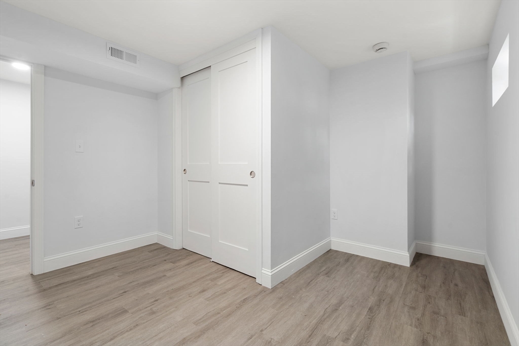 50 Bow Street Saugus, MA 01906 - Photo 26 of 37 a view of an empty room with wooden floor