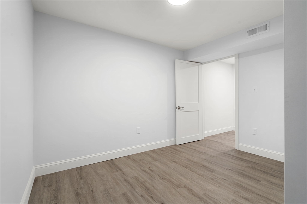 50 Bow Street Saugus, MA 01906 - Photo 27 of 37 a view of an empty room with wooden floor