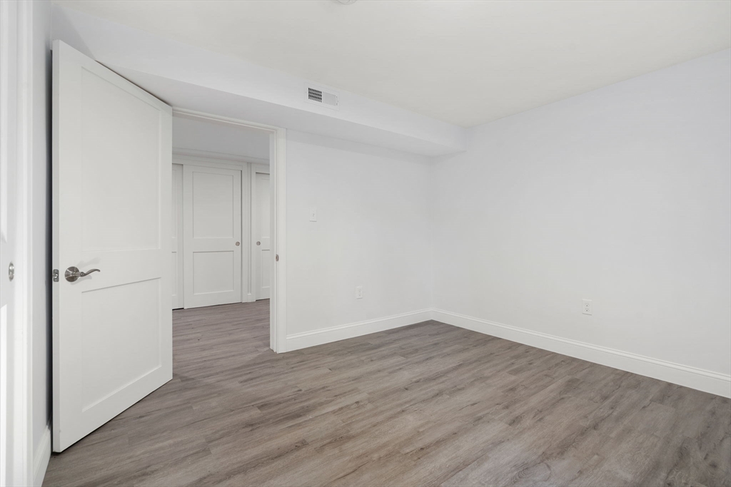 50 Bow Street Saugus, MA 01906 - Photo 29 of 37 a view of an empty room with wooden floor
