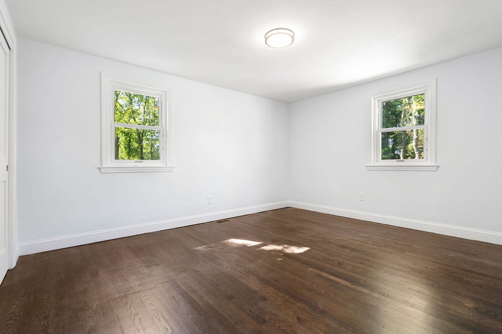 50 Bow Street Saugus, MA 01906 - Photo 3 of 37 a view of an empty room with wooden floor and a window