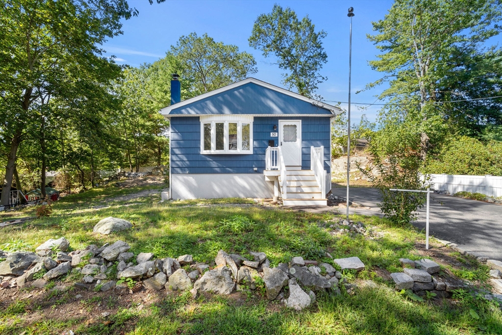 50 Bow Street Saugus, MA 01906 - Photo 36 of 37 a front view of a house with a yard