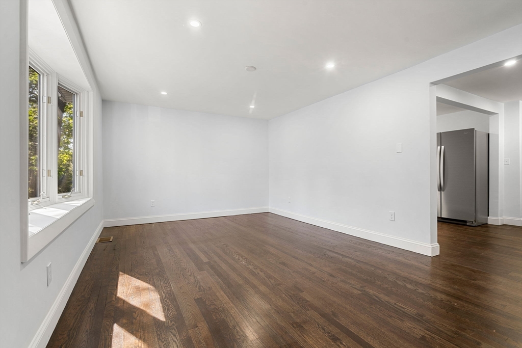 50 Bow Street Saugus, MA 01906 - Photo 6 of 37 a view of an empty room with wooden floor and a window