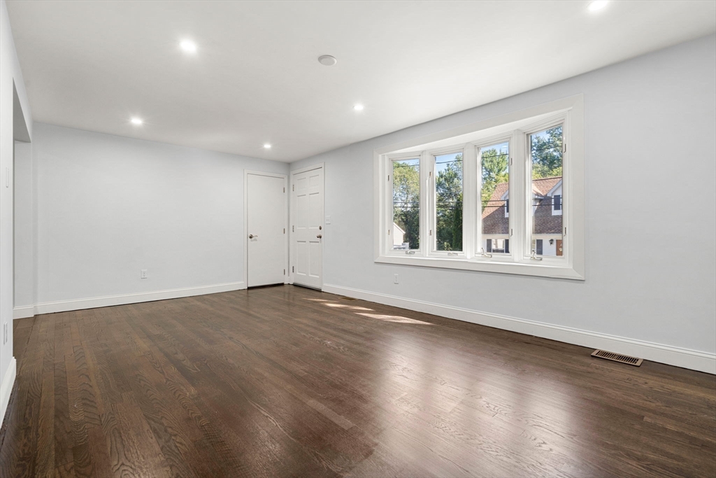 50 Bow Street Saugus, MA 01906 - Photo 8 of 37 a view of an empty room with wooden floor and a window