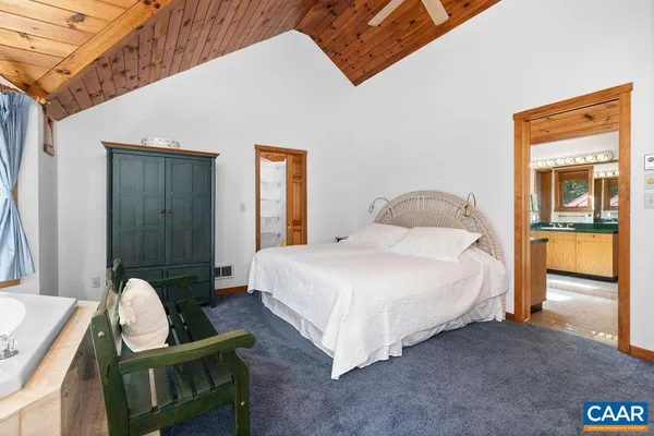 a bedroom with double bed and a window