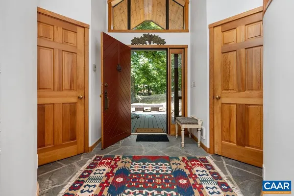 an entryway with a rug