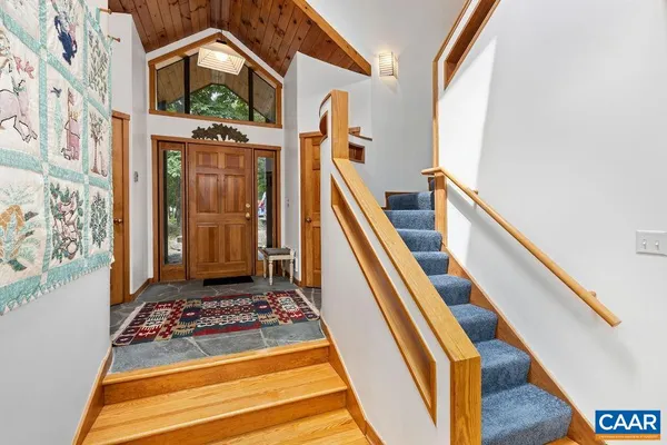 a view of a balcony with furniture and staircase