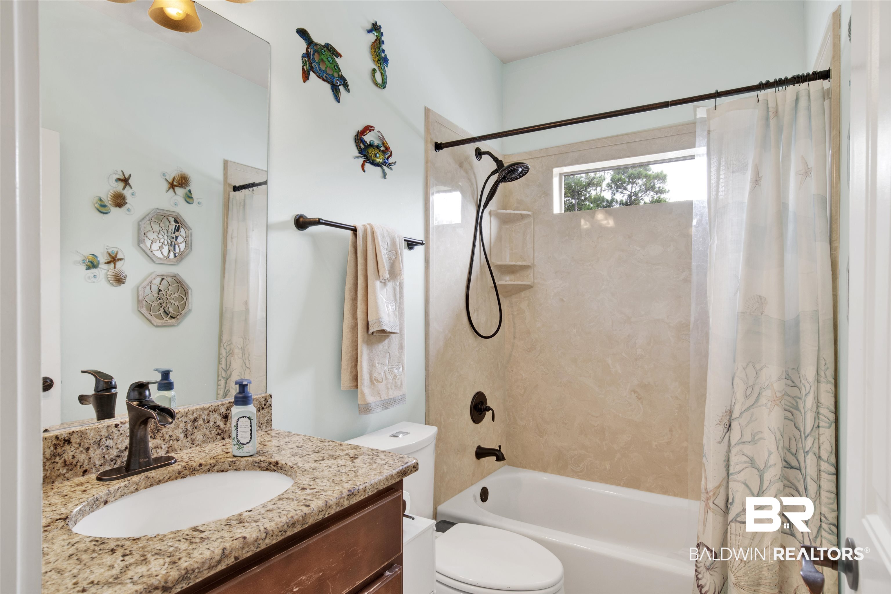 12418 Cambron Trail Daphne, AL 36527 - Photo 27 of 44 Full bathroom featuring vanity, toilet, and shower / bathtub combination with curtain
