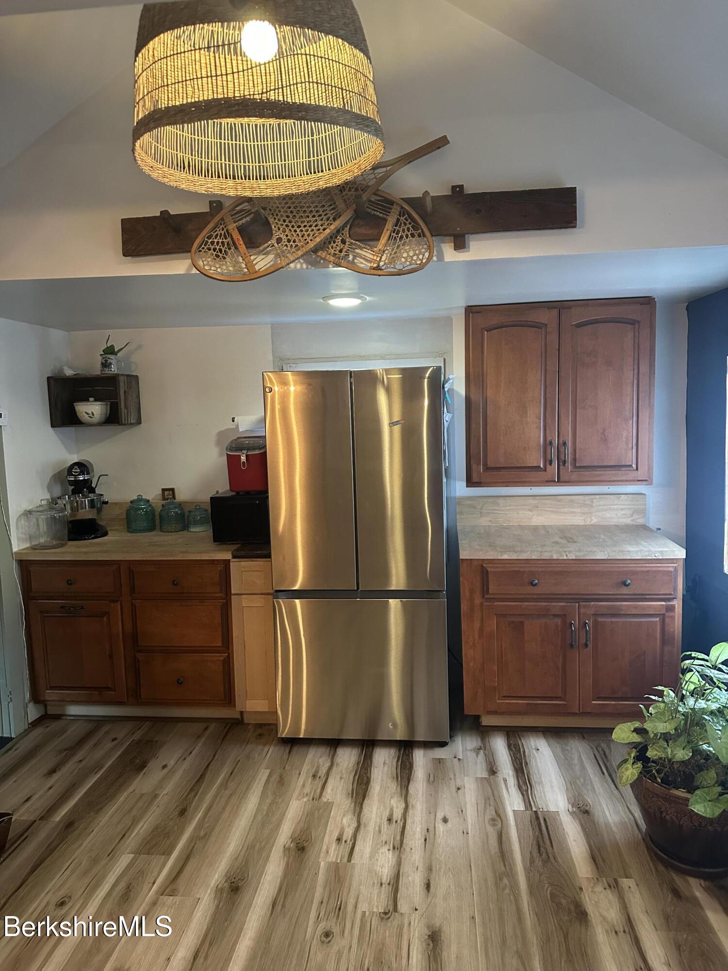 27 North Main Road Otis, MA 01253 - Photo 7 of 24 a kitchen with a refrigerator and cabinets