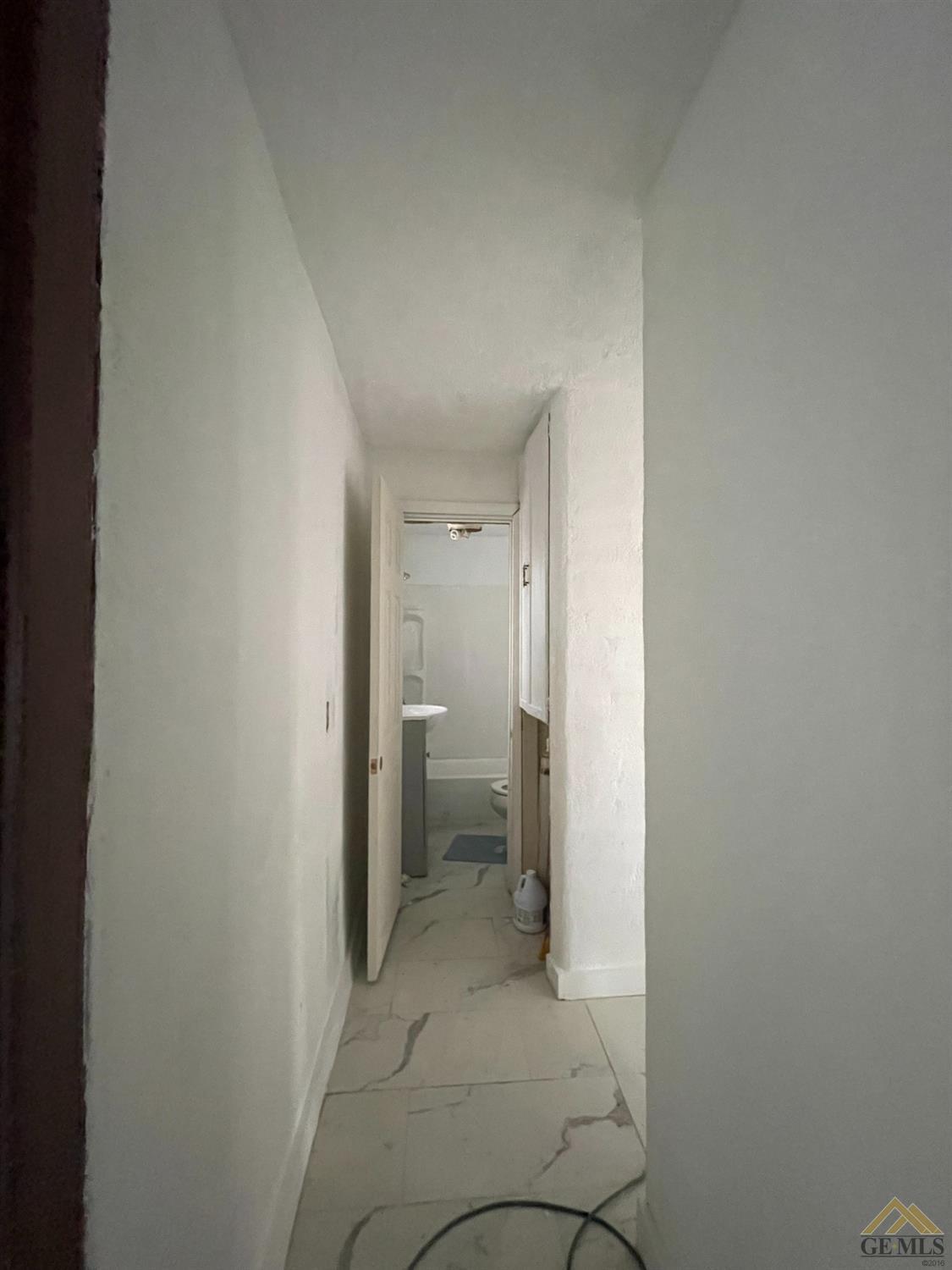 Undisclosed Address Bakersfield, CA 93308 - Photo 4 of 13 a view of a hallway with a room