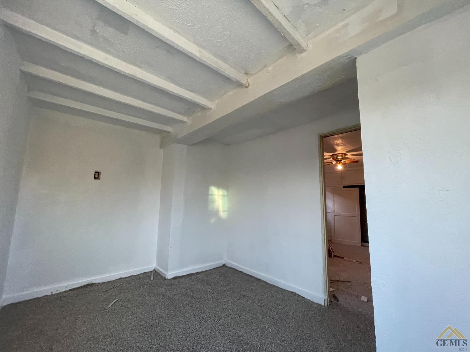 Undisclosed Address Bakersfield, CA 93308 - Photo 9 of 13 an empty room with windows