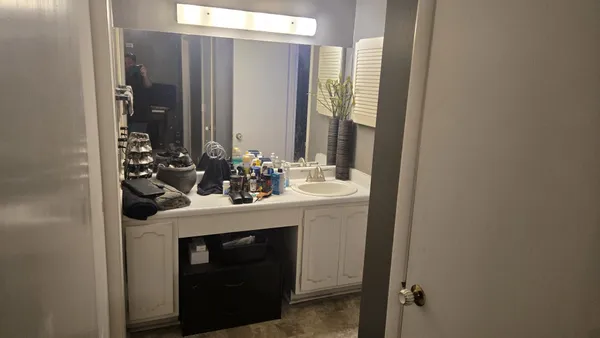 a bathroom with a sink and a mirror