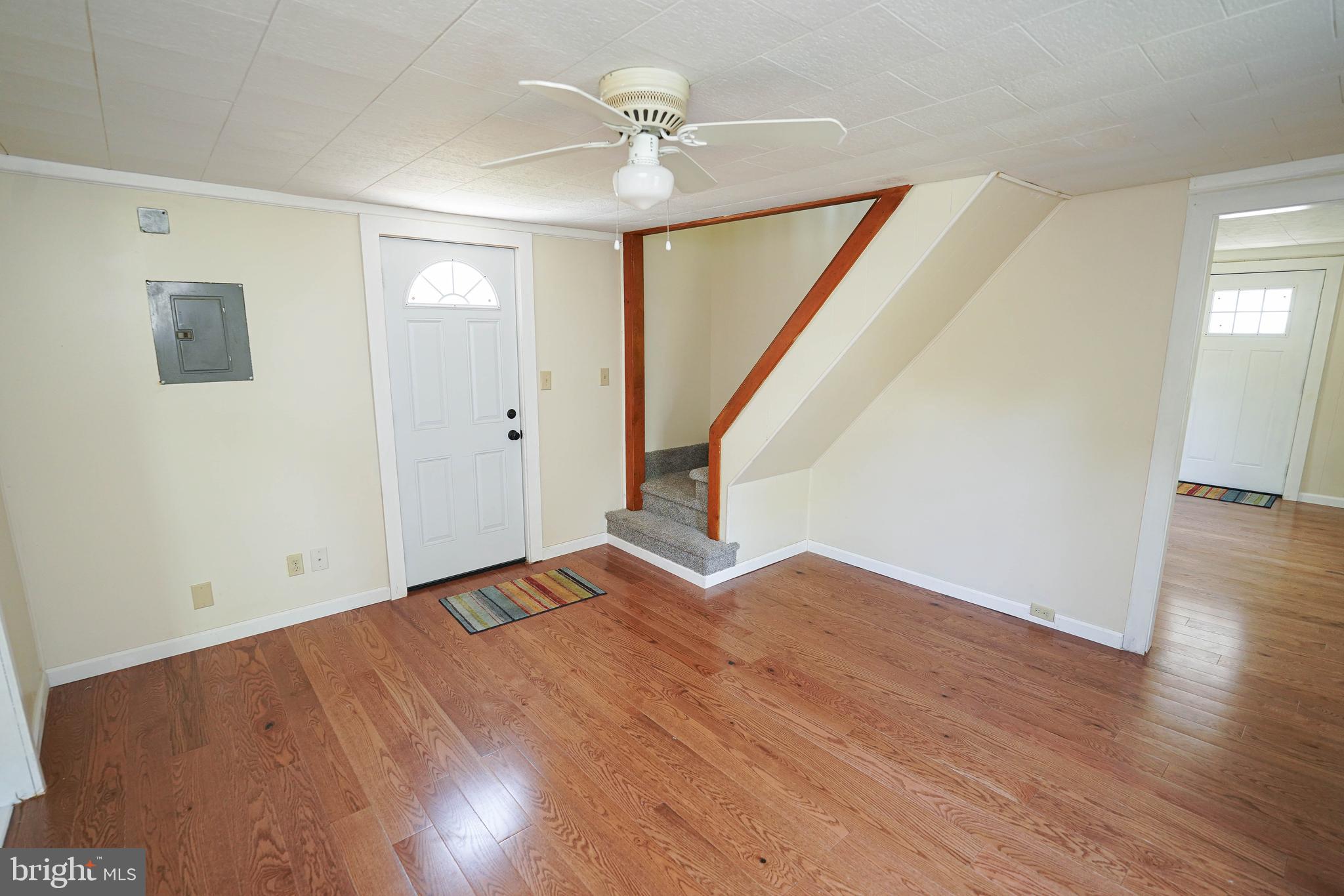 533 East 4th Street Laurel, DE 19956 - Photo 11 of 42 wooden floor in an empty room with a window