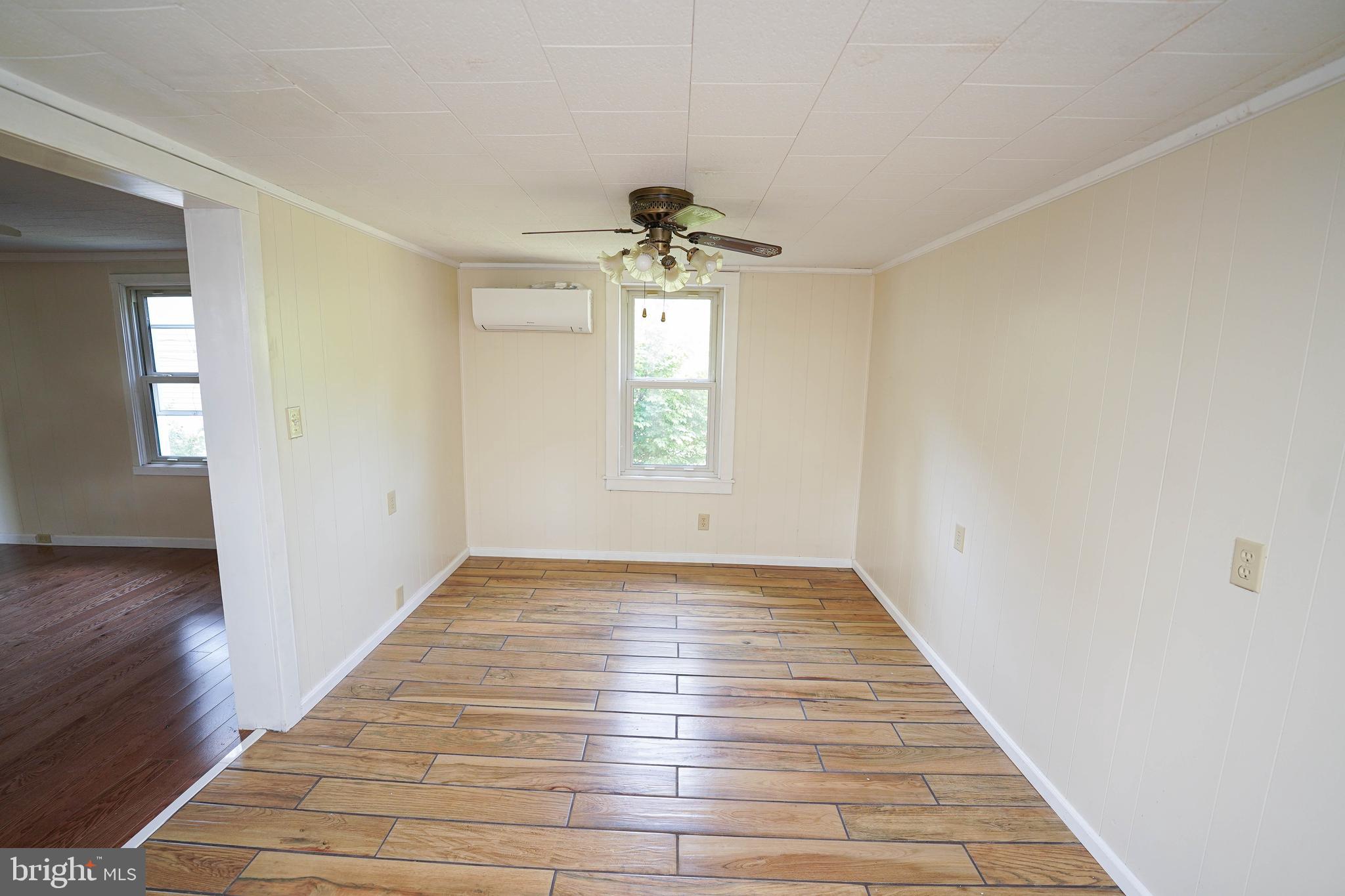 533 East 4th Street Laurel, DE 19956 - Photo 13 of 42 wooden floor in an empty room with a window