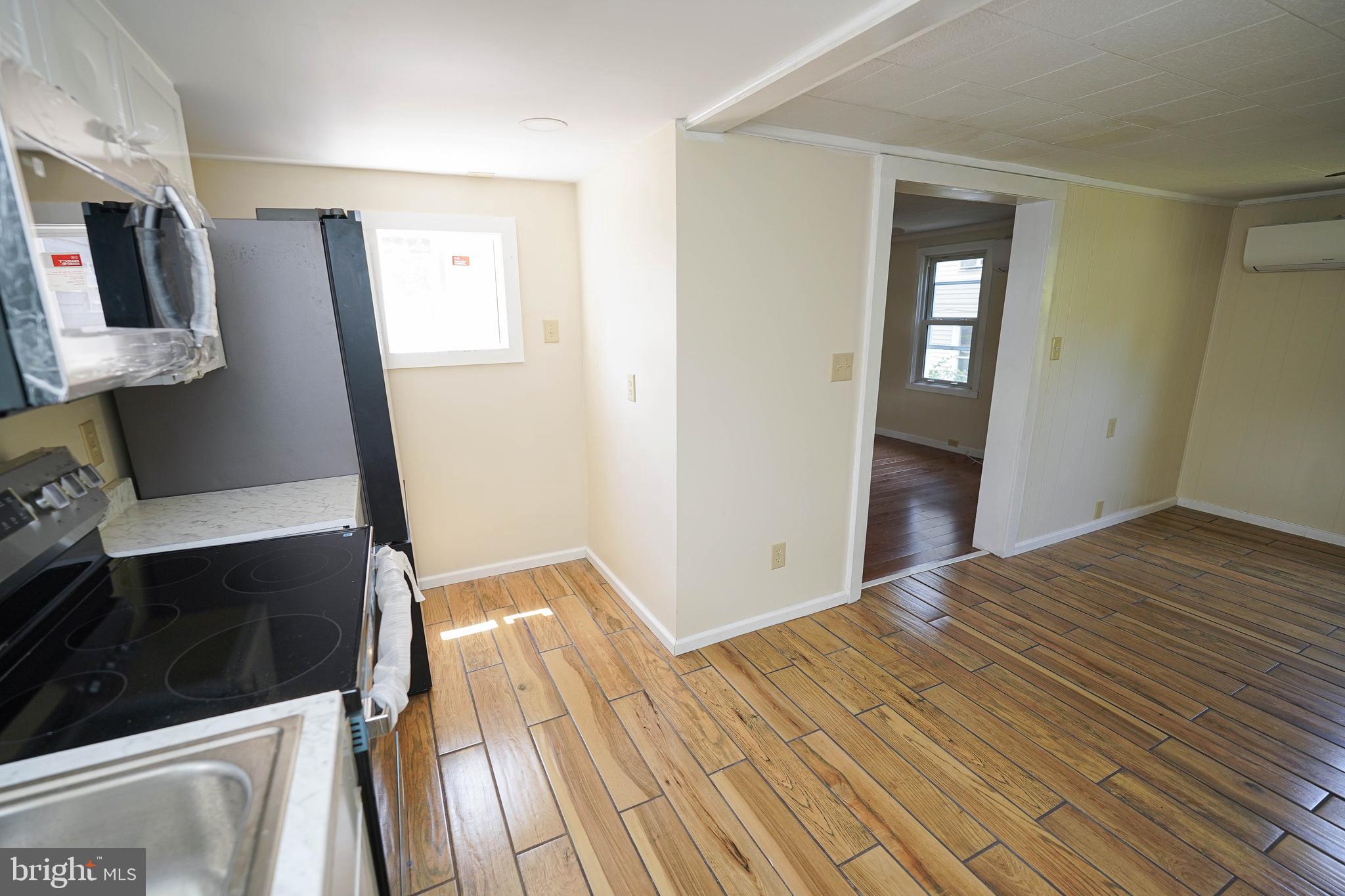 533 East 4th Street Laurel, DE 19956 - Photo 19 of 42 a view of a kitchen from an empty room