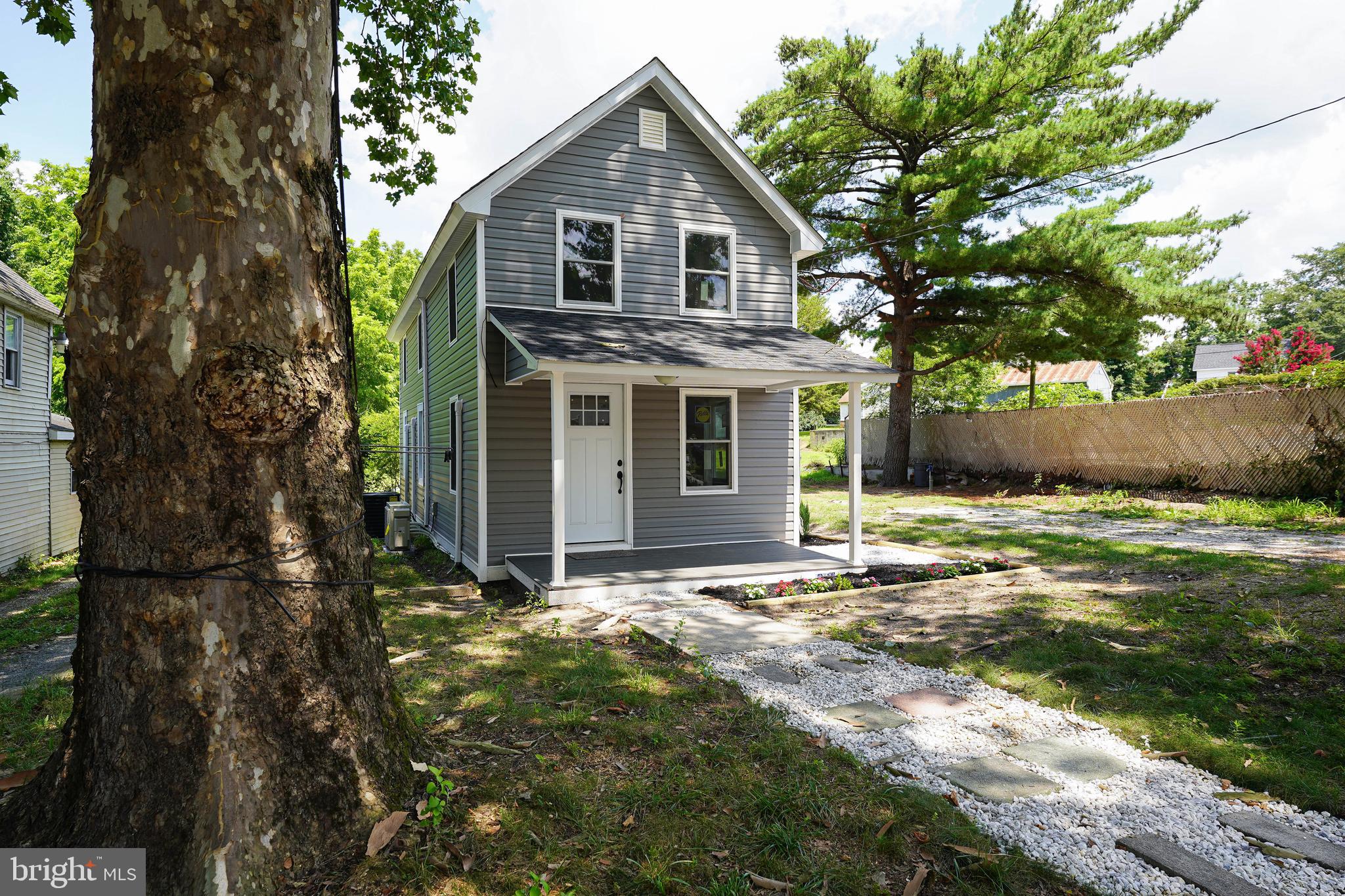 533 East 4th Street Laurel, DE 19956 - Photo 3 of 42 a front view of a house with a yard