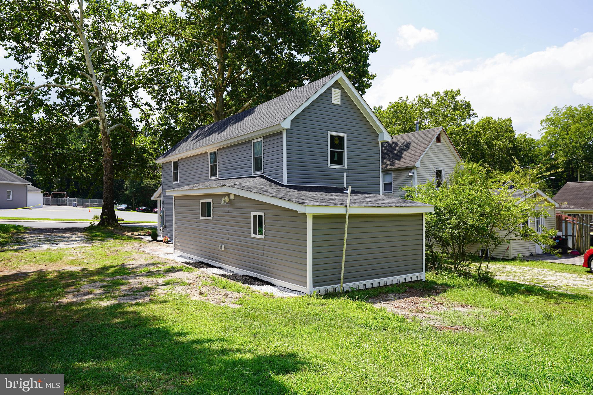 533 East 4th Street Laurel, DE 19956 - Photo 39 of 42 a front view of a house with a yard