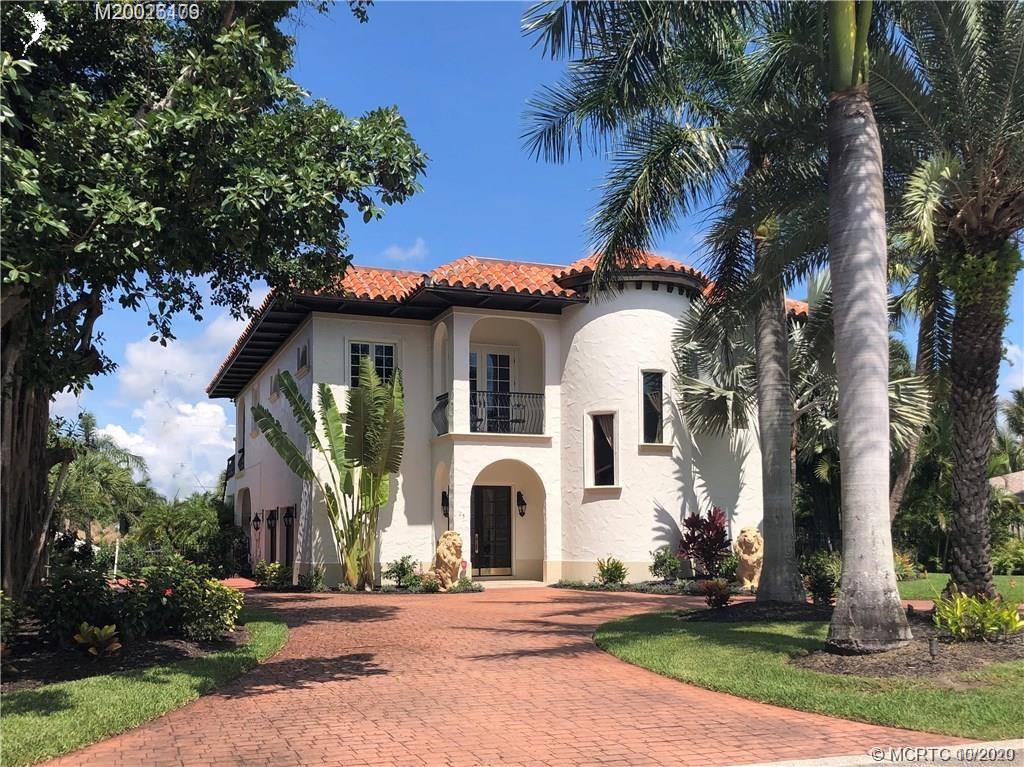 front view of a house with a garden