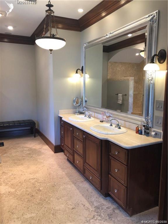 15 Middle Road Stuart, FL 34996 - Photo 11 of 28 a bathroom with a sink double vanity and a mirror
