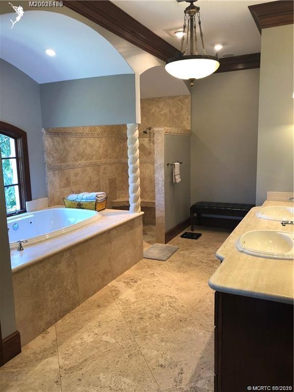 15 Middle Road Stuart, FL 34996 - Photo 12 of 28 a bathroom with a granite countertop sink a toilet and bathtub