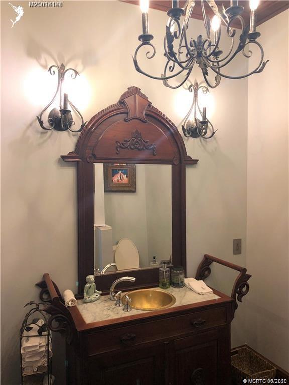 15 Middle Road Stuart, FL 34996 - Photo 13 of 28 a bathroom with a sink and a mirror