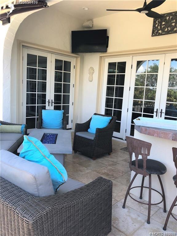 15 Middle Road Stuart, FL 34996 - Photo 14 of 28 a living room with furniture and a large window